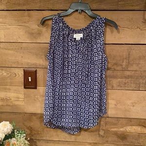 Medium blue and white flowing sleeveless blouse